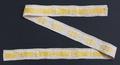 Narrow band of woven linen with geometric patterned band in yellow silk through the center