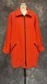 Coat of dark orange wool with dolman sleeves and fold-over collar