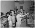 Home Economics students working in an experimental foods laboratory, March 1958