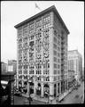 Wells Fargo building, 6th and Oak, Portland, decorated with flags and bunting. Bank on street level.