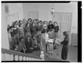 Barbara Keasey, Director of Music for Alpha Delta Pi, checks her chorus in a rehearsal under her three assistants, December 1950