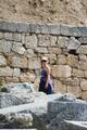 Tourist by retaining wall in gymnasium complex