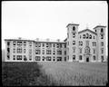 Building on campus of St. Mary's Academy (Marylhurst), Lake Oswego, Or. Lawn in foreground.