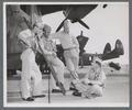 Navy officers with Martin Mariner seaplane, circa 1946