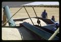 Unloading combine into bank-out, Hawkins Ranch, Umatilla County, Oregon, circa 1970