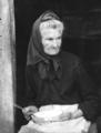 Elderly woman with bowl