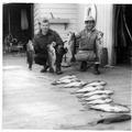 Men with fishing catch