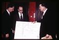 Paul Valenti, Alden Toevs, and Robert MacVicar examining Corvallis YMCA building plans, Oregon, circa 1970