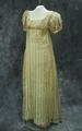 Dress of ivory striped silk with scoop neckline