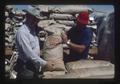 Warren Kronstad and another with sacks of Foundation seed, Oregon, 1975