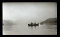 Men fishing in rowboats