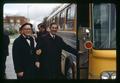 Paul Weswig and Harry Mack getting on bus to speak with Ways and Means Committee regarding faculty salaries, Oregon State University, Corvallis, Oregon, circa 1970