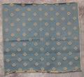 Textile Panel of soft blue wool or linen jacquard patterned with small simple flower motifs