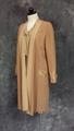 Coat of warm beige wool crepe with fabric panel accents of beige silk crepe