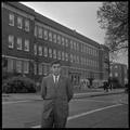 Gary Ford, a member of OSU's G.E. College Bowl team, posing outside of the Commerce Building