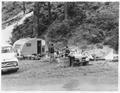 Camping family with small trailer