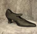 Shoe of black satin with black stitch detailing has pointed toe