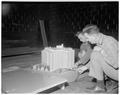 Professor Clayton and Vesta St. Clair studying wind movements, 1955