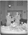 President Strand receiving a cane at an unidentified reception