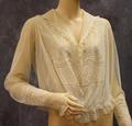 Blouse of ivory marquisette with panels of embroidered cotton batiste with vines and open-work at torso and wrists
