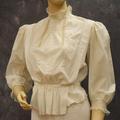 Blouse of white cotton with lace band collar and lace cuffs