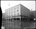 Central Building, 10th and Alder, Portland. Atiyeh Brother's Rugs on corner, street in foreground.