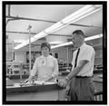 Jean Saubert, OSU student and Olympic skiing medalist, with a faculty member in the laboratory, July 1964