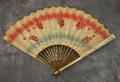 Folding fan of hand-painted paper in a red, grey, white and silver floral motif