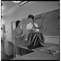 Students examining chair textiles, February 1964