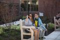 Two students on bench outside of Global Scholars Hall