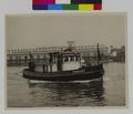 Harbor Patrol Boat 'F.W. Mulkey' and crew; Municipal terminal no. 2 in background. (recto)