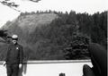 Ranger (John Currie) standing on dock at Visitor center look north at Cape Perpetua