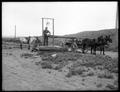 Filling water wagon (by bucket).