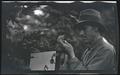 William L. Finley photographing a chipmunk