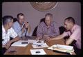 Horace Cheney, Stoney Jackson, T.J. Starker, and Russell Ellis looking at bark pellets, circa 1965