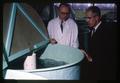 Dean of Pharmacy Charles Wilson and Joe Wales examining trout at hepatoma laboratory, Oregon State University, Corvallis, Oregon, circa 1968