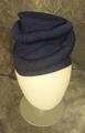 Toque-like hat of deep blue jersey crepe