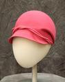 Jockey hat of hot pink wool felt with large bowl-like crown and short brim