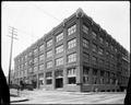 Fuller Paint Co. at Davis and E. 12th, Portland. Horse-drawn delivery wagon at loading dock.