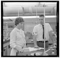 Jean Saubert, OSU student and Olympic skiing medalist, with a faculty member in the laboratory, July 1964