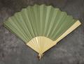 Folding fan of ivory or bone sticks mounted with sea green silk