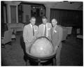 Participants in a Summer Session open house examine an oversized globe, Memorial Union