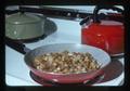 Fried potatoes in pan on stove, 1975