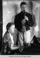 Mary Home, composer, at the keyboard and her son, Caldren, playing recorder