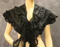 Capulet of tiered black silk with embroidery and pleated silk chiffon