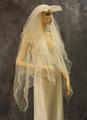 Veil of white tulle with wire frame creating a squared visor in front