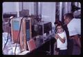 Children looking at laboratory equipment, circa 1965
