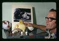 Dave England with pig figurine collection, Oregon State University, Corvallis, Oregon, circa 1971