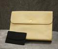 Clutch of pale yellow and grey faux leather