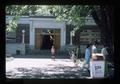 Boy posing near entrance to Oregon State University Men's Gymnasium, Corvallis, Oregon, 1975